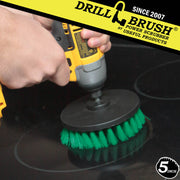 Drillbrush 5 inch Medium Green Kitchen Brush cleaning an electric stovetop.
