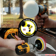 A soft white scrub pad attached to a drill scrubbing a window. A stiff red pad on a drill scrubbing a sink wall.