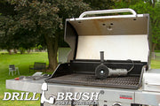 Drillbrush 5 inch Ultra Stiff Black Threaded brush in a polisher on a grill in a backyard.