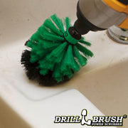 Drillbrush Mini Medium Green Kitchen Brush cleaning around a sink.