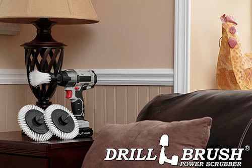 2 Drillbrush Soft White Home and Auto Edge brushes and a Soft White 1 inch Long brush in a cordless drill on a living room end table.