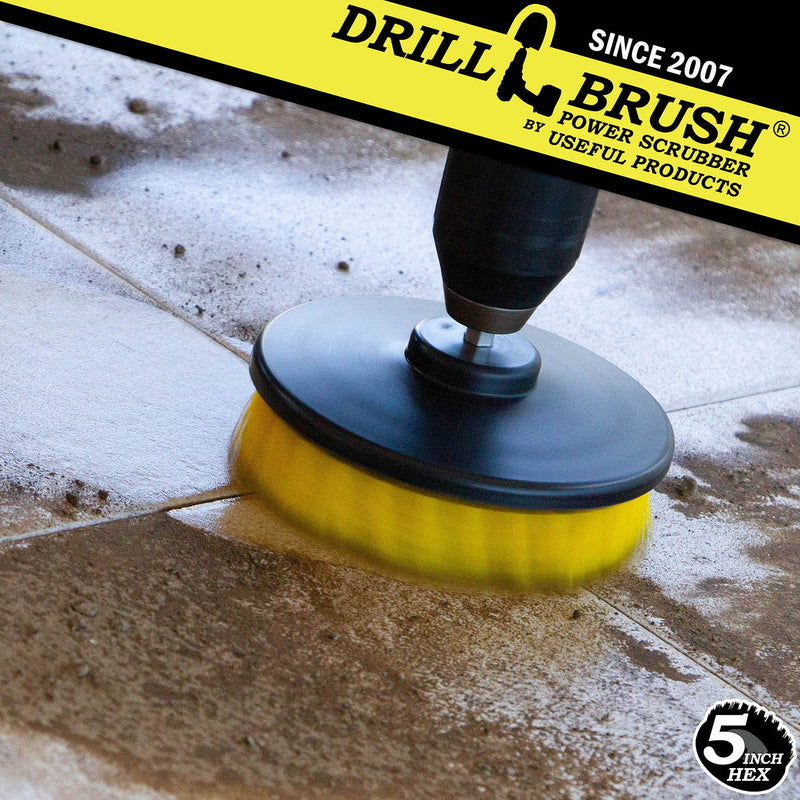 Drillbrush 5 inch Hex Medium Yellow Bathroom Brush cleaning a dirt-covered tile floor.
