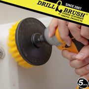 Drillbrush 5 inch Medium Yellow Bathroom Brush cleaning the walls of a shower.