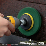 The Drillbrush Abrasive Green 5 inch Scrubbing Pad attached to a 3 inch backer (not included) cleaning the inside of a grill's hood.