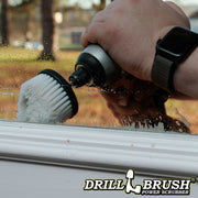 Drillbrush Soft White Cone-shaped Corner brush cleaning a window.
