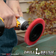 Drillbrush Stiff Red Outdoor and Patio Edge Brush cleaning a vinyl table.