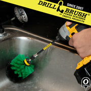 Drillbrush Original Medium Green Kitchen Brush in a 5 inch extension cleaning a sink.
