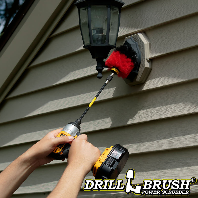 Drillbrush Original Stiff Red Outdoor & Patio Brush in a 7 inch extension cleaning a high-up outdoor lamp.