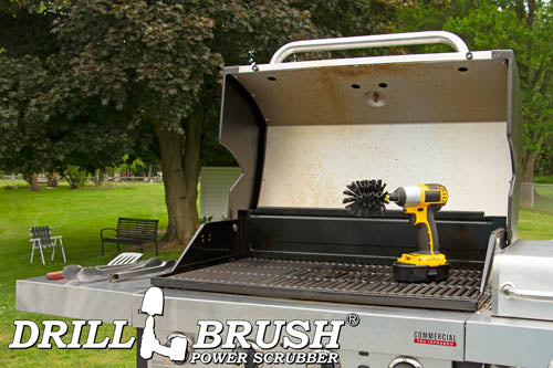 Drillbrush Original Ultra Stiff Black Grill & Industrial Brush on an open grill in front of a backyard.