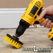 Drillbrush 4 inch Medium Yellow Bathroom Brush cleaning tile grout on a bathroom floor.