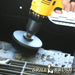 Drillbrush 4 inch Ultra Stiff Black Grill & Industrial Brush cleaning a grill burner shield.