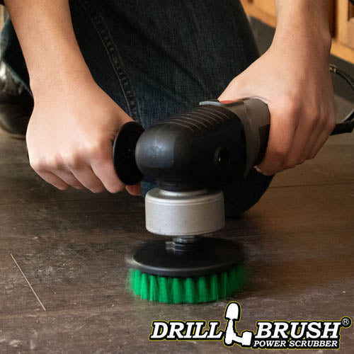 Drillbrush 5 inch Threaded Medium Green Kitchen Brush cleaning a kitchen floor.