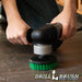 Drillbrush 5 inch Threaded Medium Green Kitchen Brush cleaning a kitchen floor.