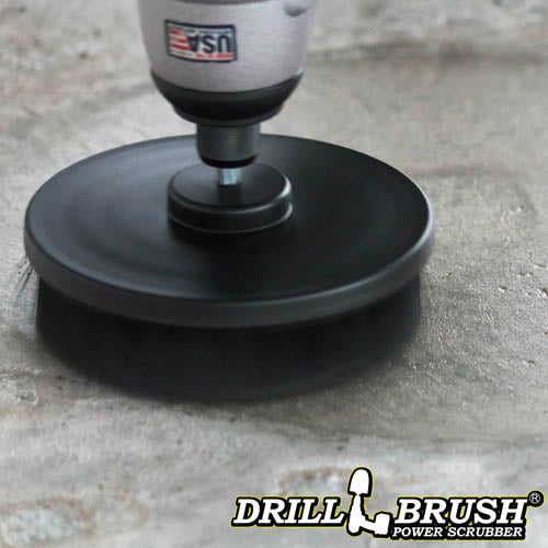 Drillbrush 5 inch Ultra Stiff Black Grill & Industrial Brush cleaning a concrete floor.