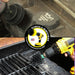 Action shots of an Ultra Stiff Black 2 inch Drillbrush cleaning an engine block and an Ultra Stiff Black Mini Drillbrush cleaning a grill grate.