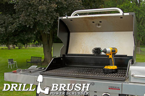Drillbrush Mini Ultra Stiff Black Grill & Industrial Brush on an open grill in front of a backyard.