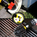 Action shots of a Stiff Red Original Drillbrush cleaning a waterspout and an Ultra Stiff Black Original Drillbrush cleaning grill grates.