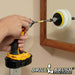 The Drillbrush White 4 inch Scrubbing Pads on a 3 inch backer attached to an extension in a cordless drill cleaning a bathroom cabinet mirror.