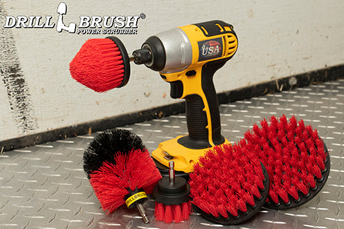 Stiff Red Drillbrush 542CO kit with a cordless drill on diamond plating in a garage.