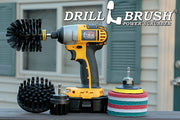 The Ultra Stiff Black Drillbrush 42O Grill & Industrial Kit with six 4 inch Variety Pads with an Original in a cordless drill on a wooden railing on a deck in front of window.
