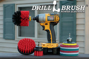 The Stiff Red Drillbrush 42O Outdoor & Patio Kit with six 4 inch Variety Pads with an Original in a cordless drill on a wooden railing on a deck in front of window.
