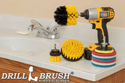 The Medium Yellow Drillbrush 42O Bathroom Kit with six Variety Pads with an Original in a cordless drill on a bathroom counter in front of a sink.